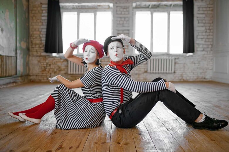 male and female mime artists sitting on the floor 2021 09 01 07 42 45 utc